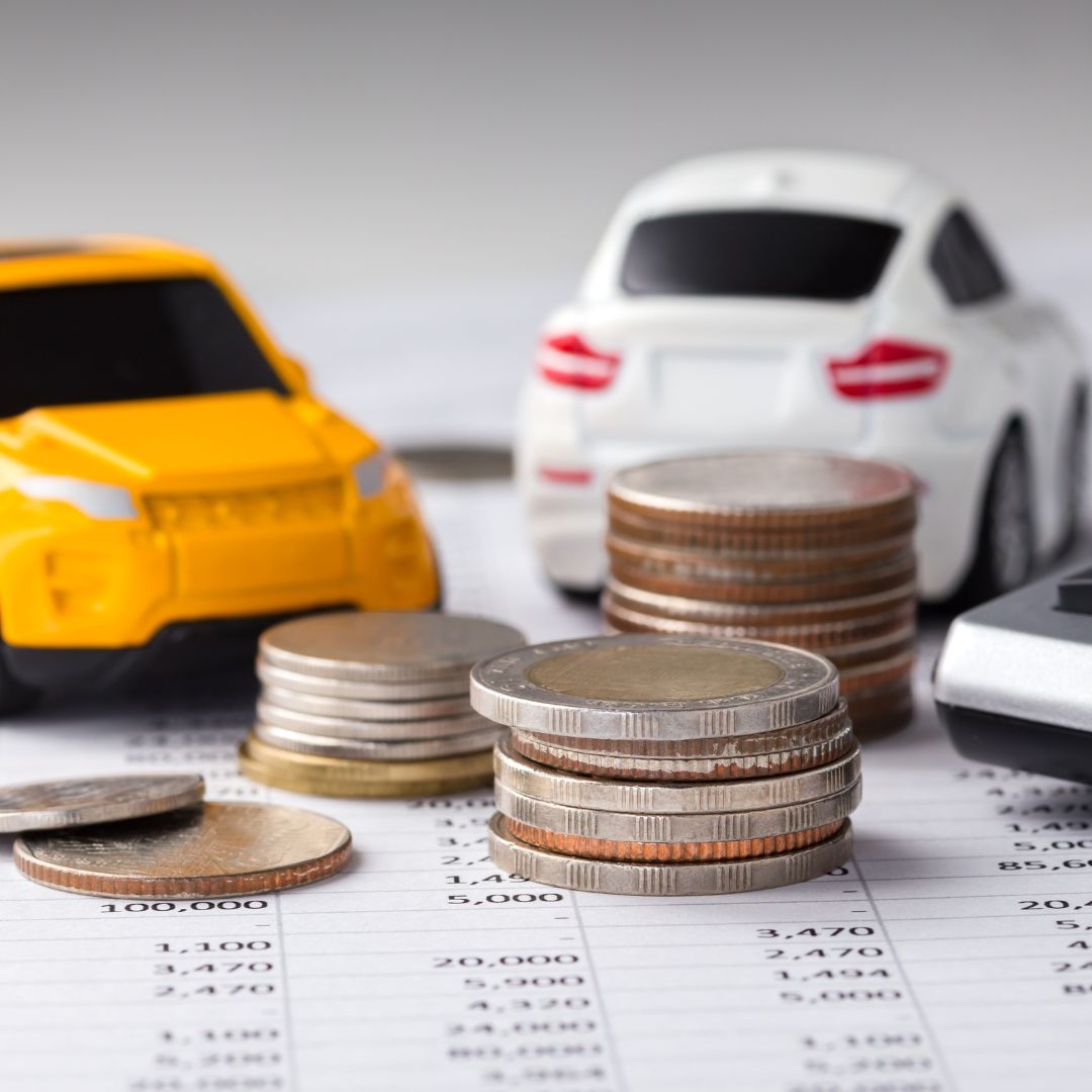 toy cars on a loan sheet with coins